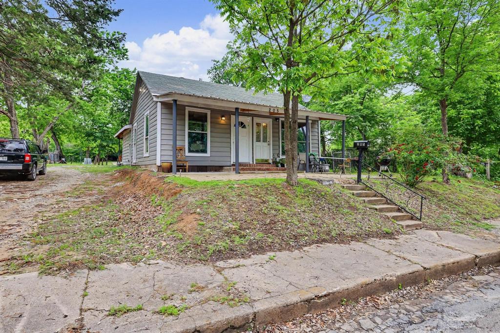 205 South Main Street Bonham, TX 75418 - Photo 23 of 23 a front view of house with yard and green space