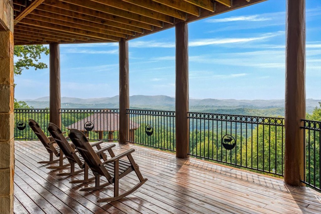373 Rising Star Lane Mineral Bluff, GA 30559 - Photo 28 of 98 a view of a balcony with wooden floor next to a yard