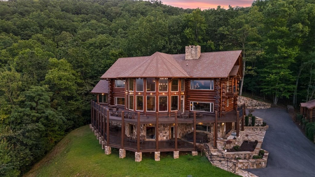 373 Rising Star Lane Mineral Bluff, GA 30559 - Photo 3 of 98 a roof deck with table and chairs under an umbrella