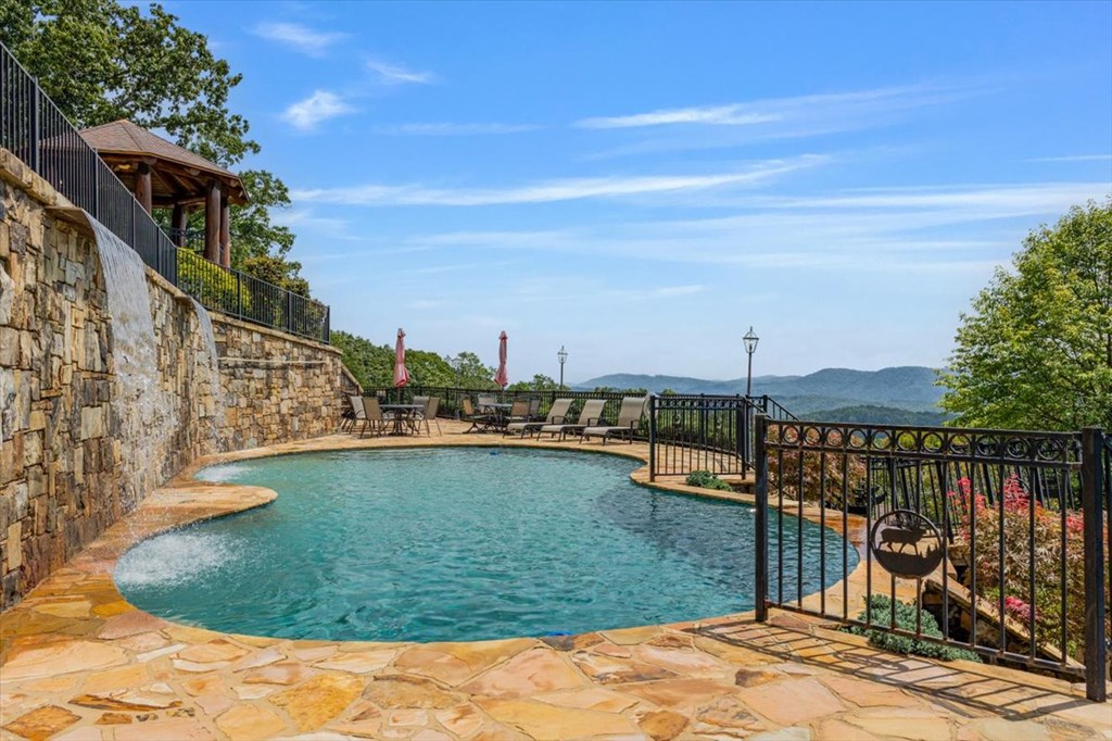 373 Rising Star Lane Mineral Bluff, GA 30559 - Photo 32 of 98 a view of a swimming pool with a lake from a seating space