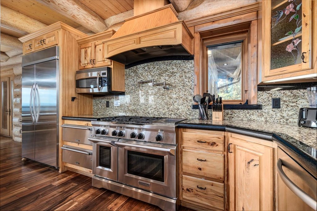 373 Rising Star Lane Mineral Bluff, GA 30559 - Photo 44 of 98 a kitchen with stainless steel appliances granite countertop a stove and a sink
