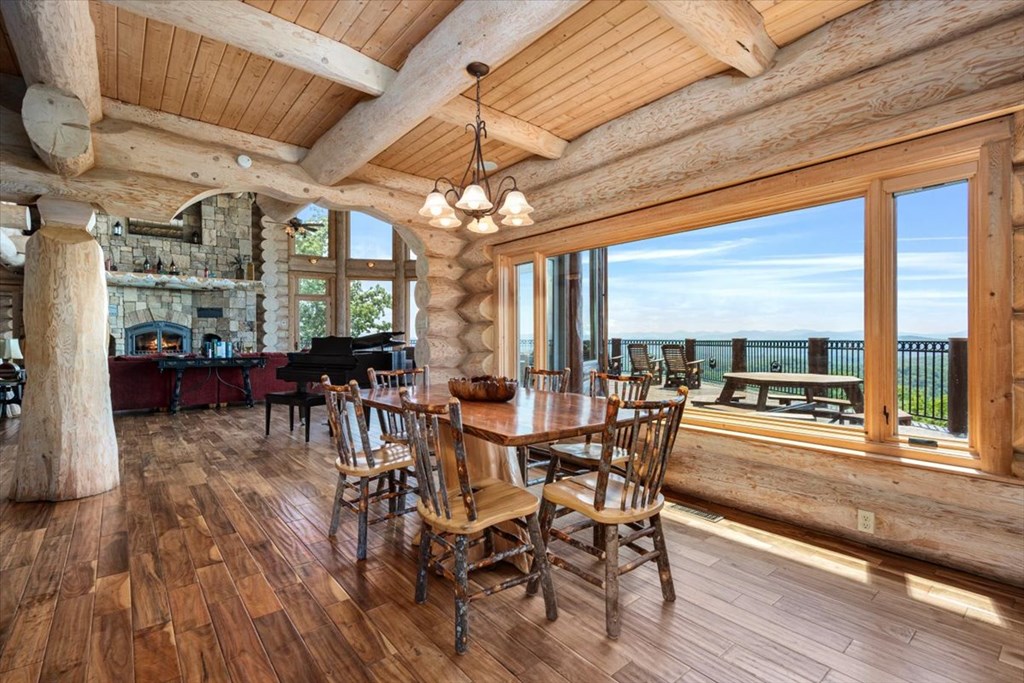 373 Rising Star Lane Mineral Bluff, GA 30559 - Photo 47 of 98 a view of a dining room with furniture large windows and wooden floor