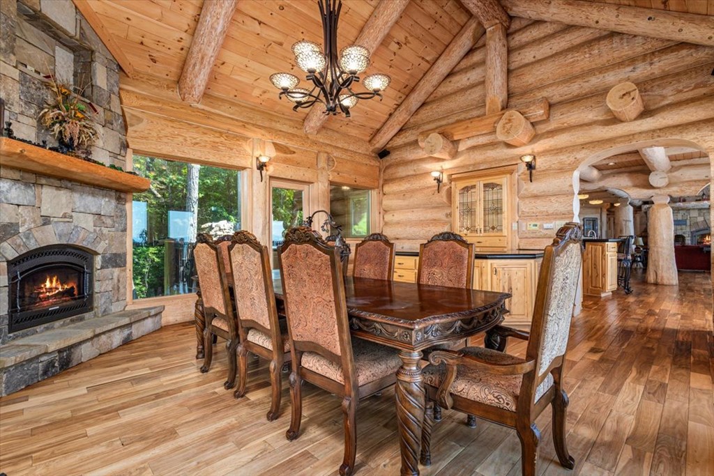 373 Rising Star Lane Mineral Bluff, GA 30559 - Photo 48 of 98 a view of a dining room with furniture wooden floor and chandelier