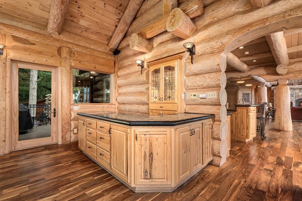 373 Rising Star Lane Mineral Bluff, GA 30559 - Photo 50 of 98 a kitchen with stainless steel appliances granite countertop a sink and wooden cabinets