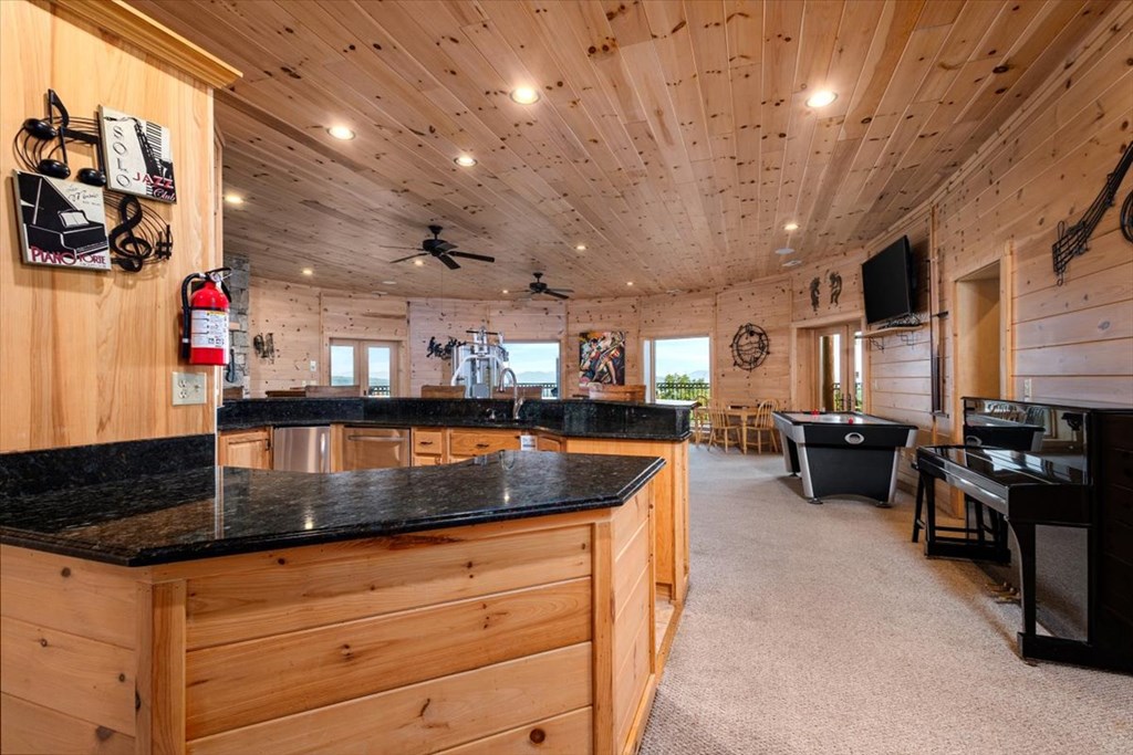 373 Rising Star Lane Mineral Bluff, GA 30559 - Photo 81 of 98 a kitchen with stainless steel appliances granite countertop a sink a stove and a wooden cabinets
