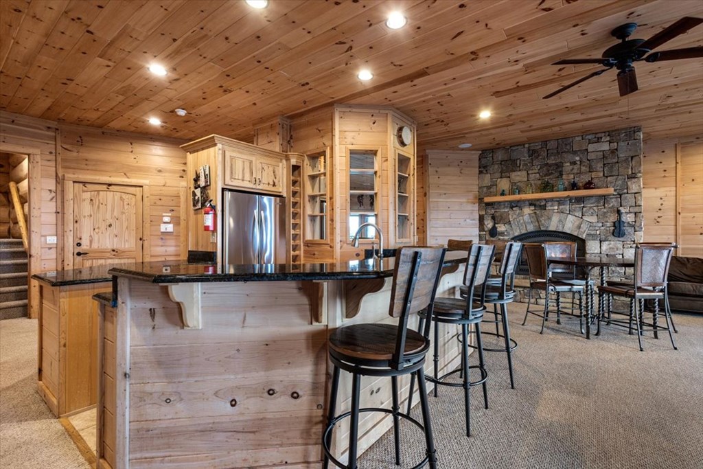 373 Rising Star Lane Mineral Bluff, GA 30559 - Photo 83 of 98 a dining hall with stainless steel appliances granite countertop furniture and fireplace