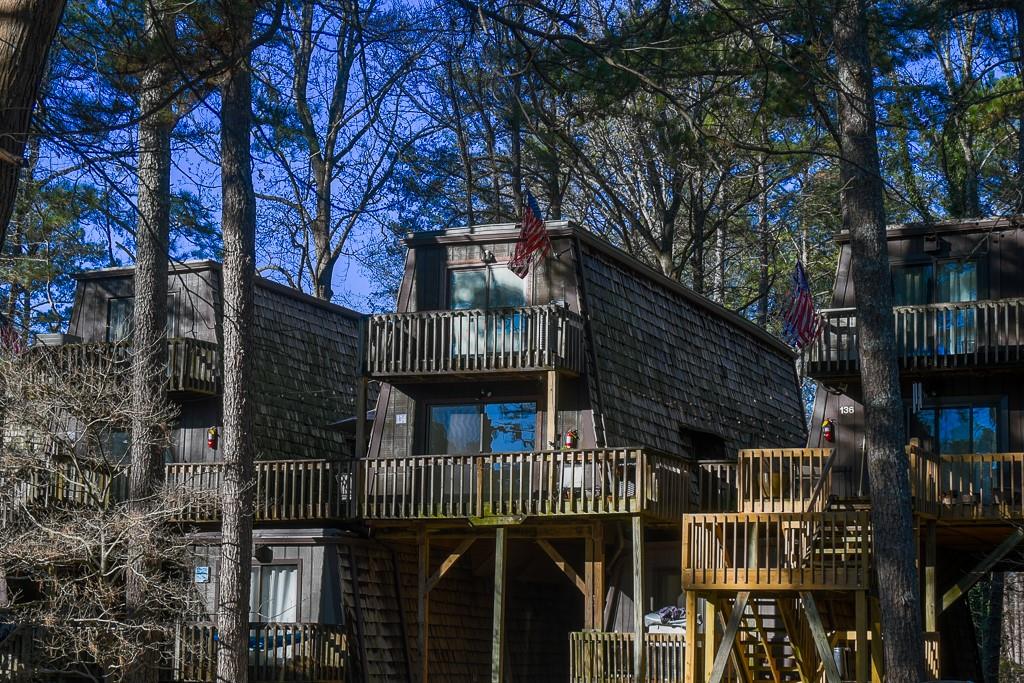 3200 Rim Cove Drive, Unit 134 Cumming, GA 30041 - Photo 1 of 20 a view of balcony with small trees