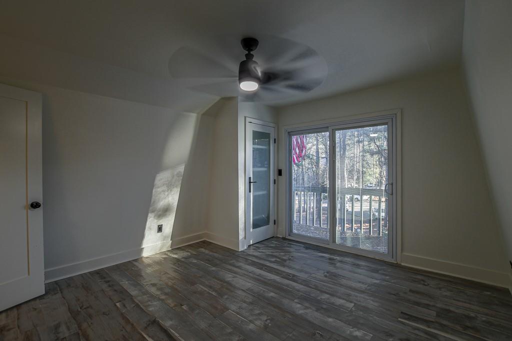 3200 Rim Cove Drive, Unit 134 Cumming, GA 30041 - Photo 16 of 20 wooden floor in an empty room with a window