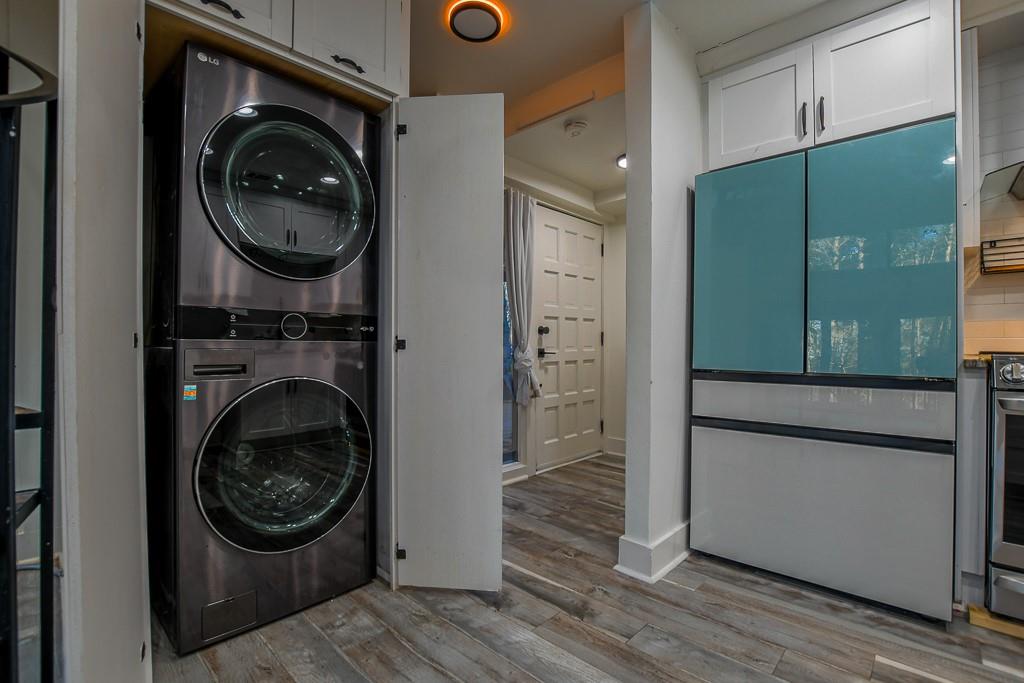 3200 Rim Cove Drive, Unit 134 Cumming, GA 30041 - Photo 8 of 20 a view of a storage and utility room with washer and dryer