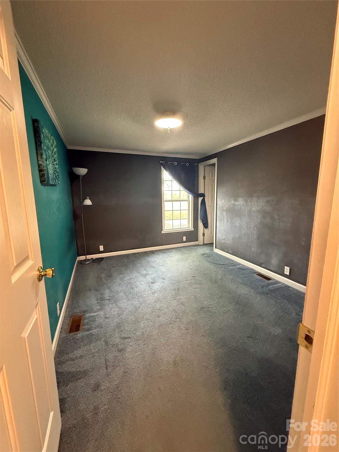 367 High Point Church Road Pageland, SC 29728 - Photo 13 of 17 an empty room with windows and stairs