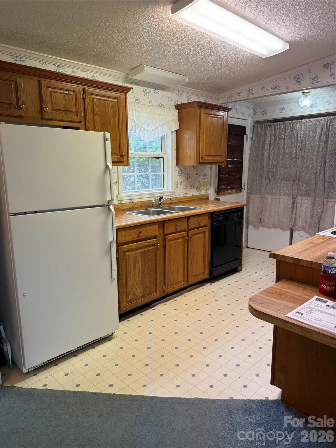 367 High Point Church Road Pageland, SC 29728 - Photo 6 of 17 a kitchen with granite countertop a sink a stove a refrigerator and a front door
