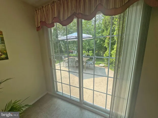 a view of a room with a large window and floor to ceiling window