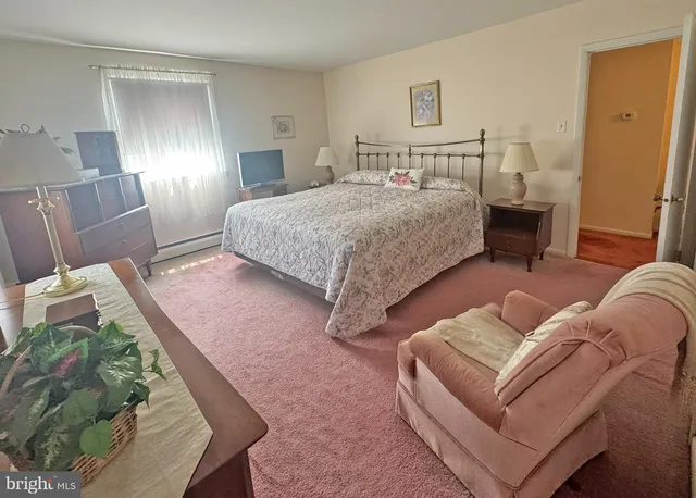 a bathroom with a toilet sink vanity and mirror
