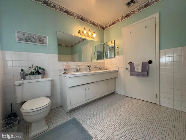 a spacious bedroom with a bed and window