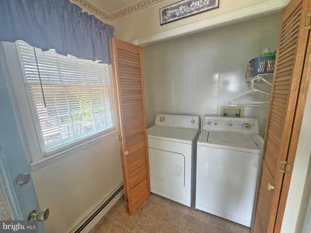a bathroom with a sink mirror vanity and toilet