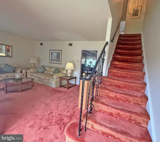 a view of entryway livingroom and hall