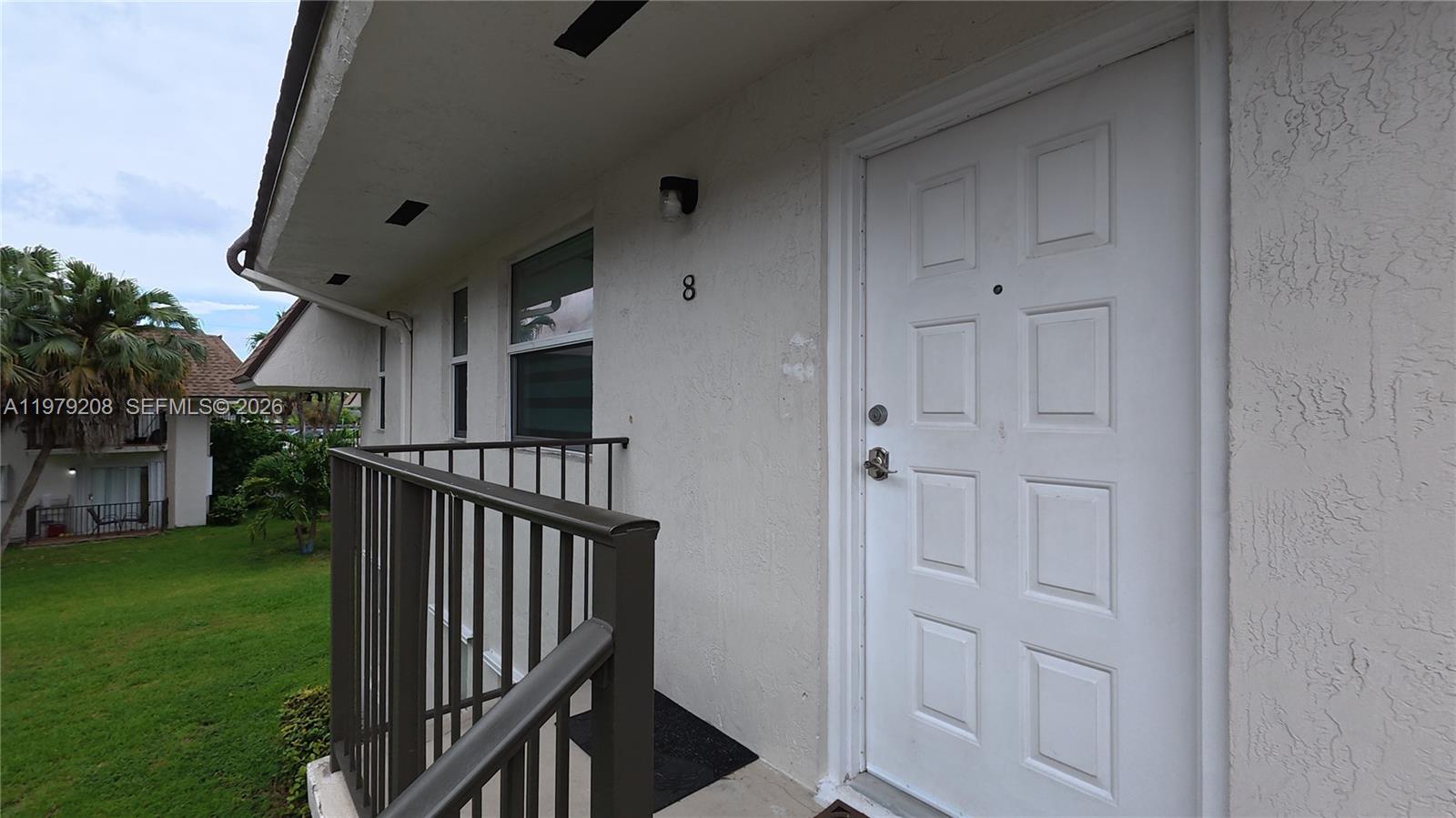7121 Southwest 129th Avenue, Unit 8 Miami, FL 33183 - Photo 1 of 13 a view of entryway with yard
