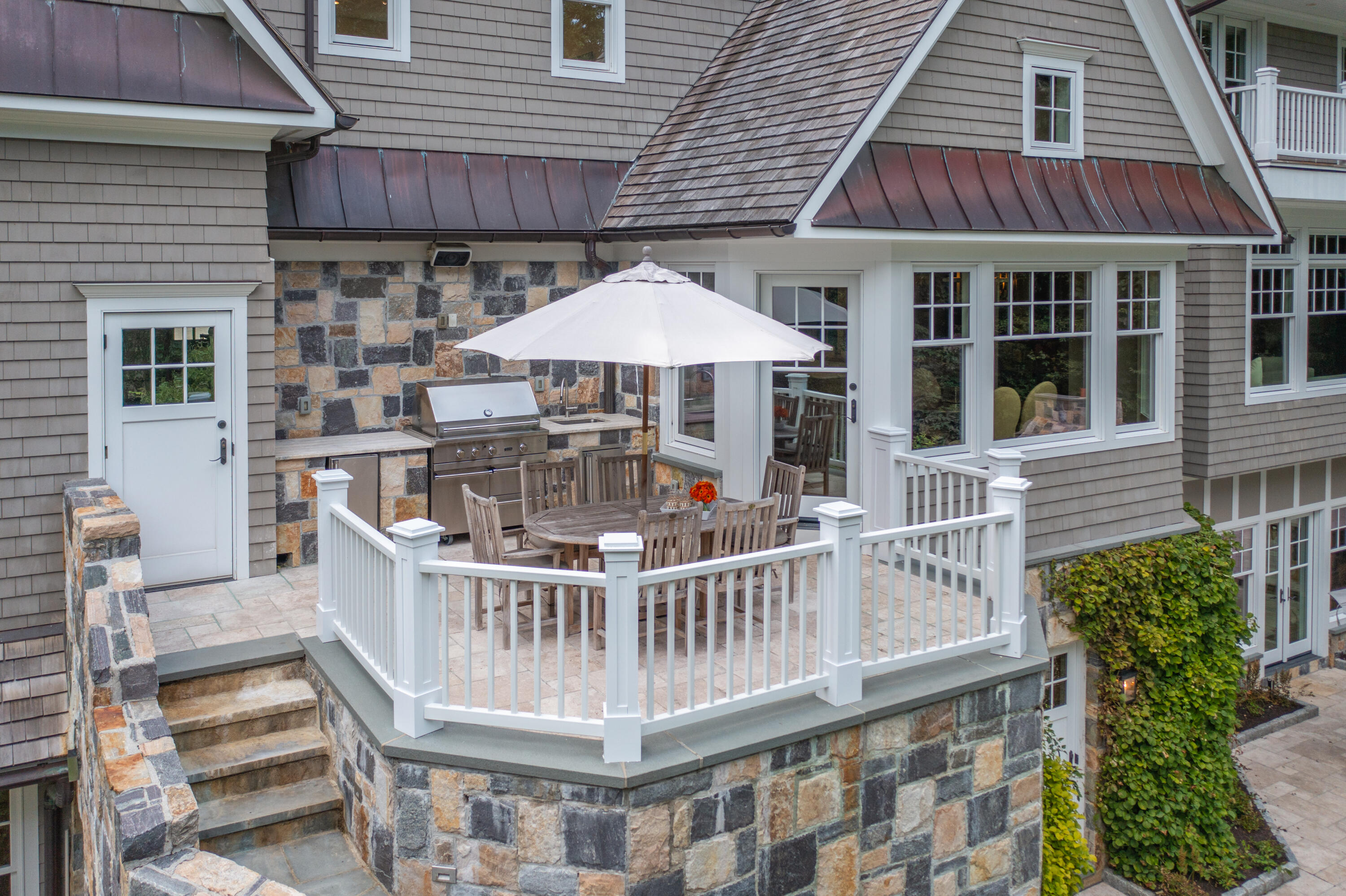 163 Chichester Road New Canaan, CT 06840 - Photo 13 of 40 an outdoor view of house with deck outdoor seating and barbeque oven