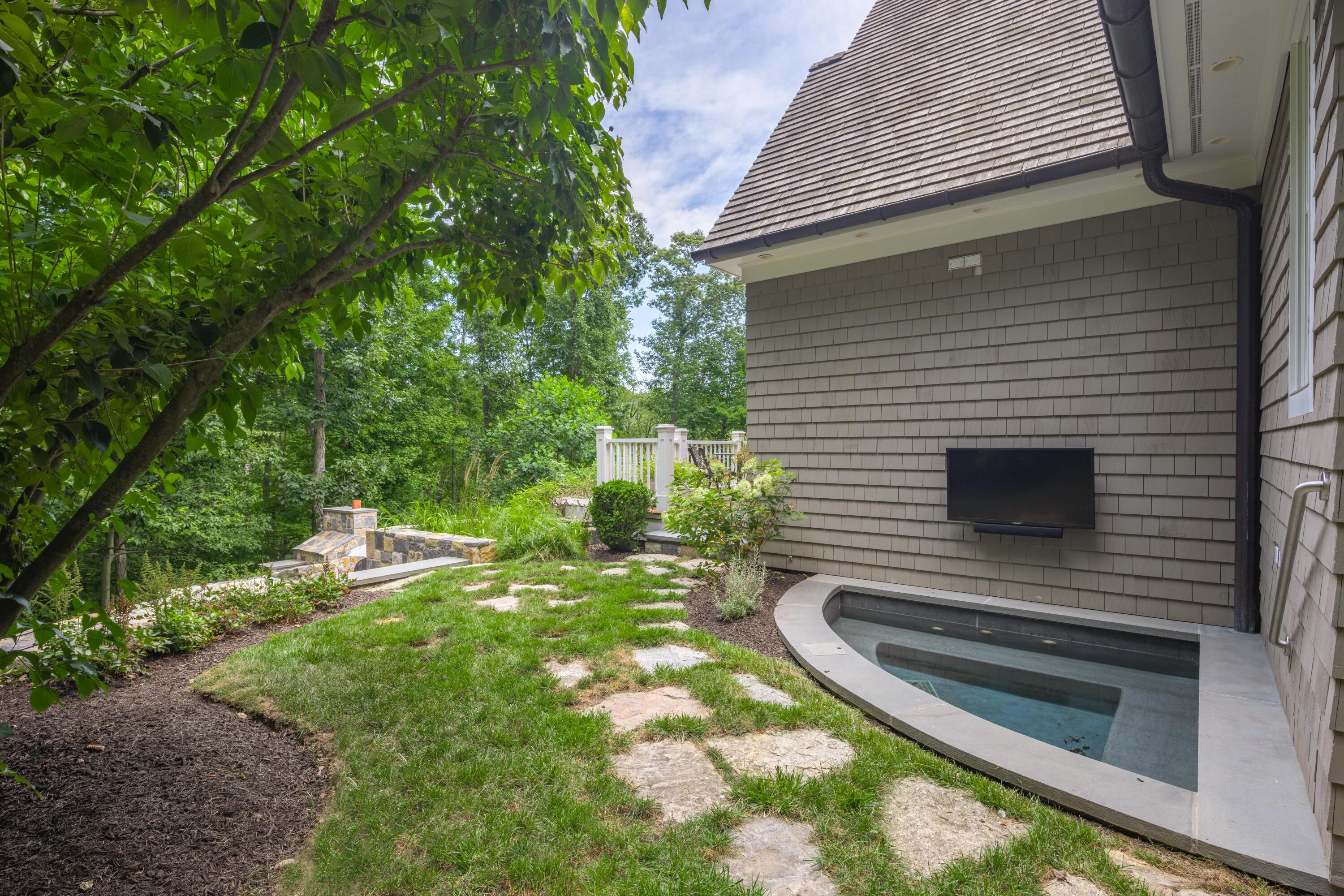 163 Chichester Road New Canaan, CT 06840 - Photo 19 of 40 a backyard of a house with lots of green space