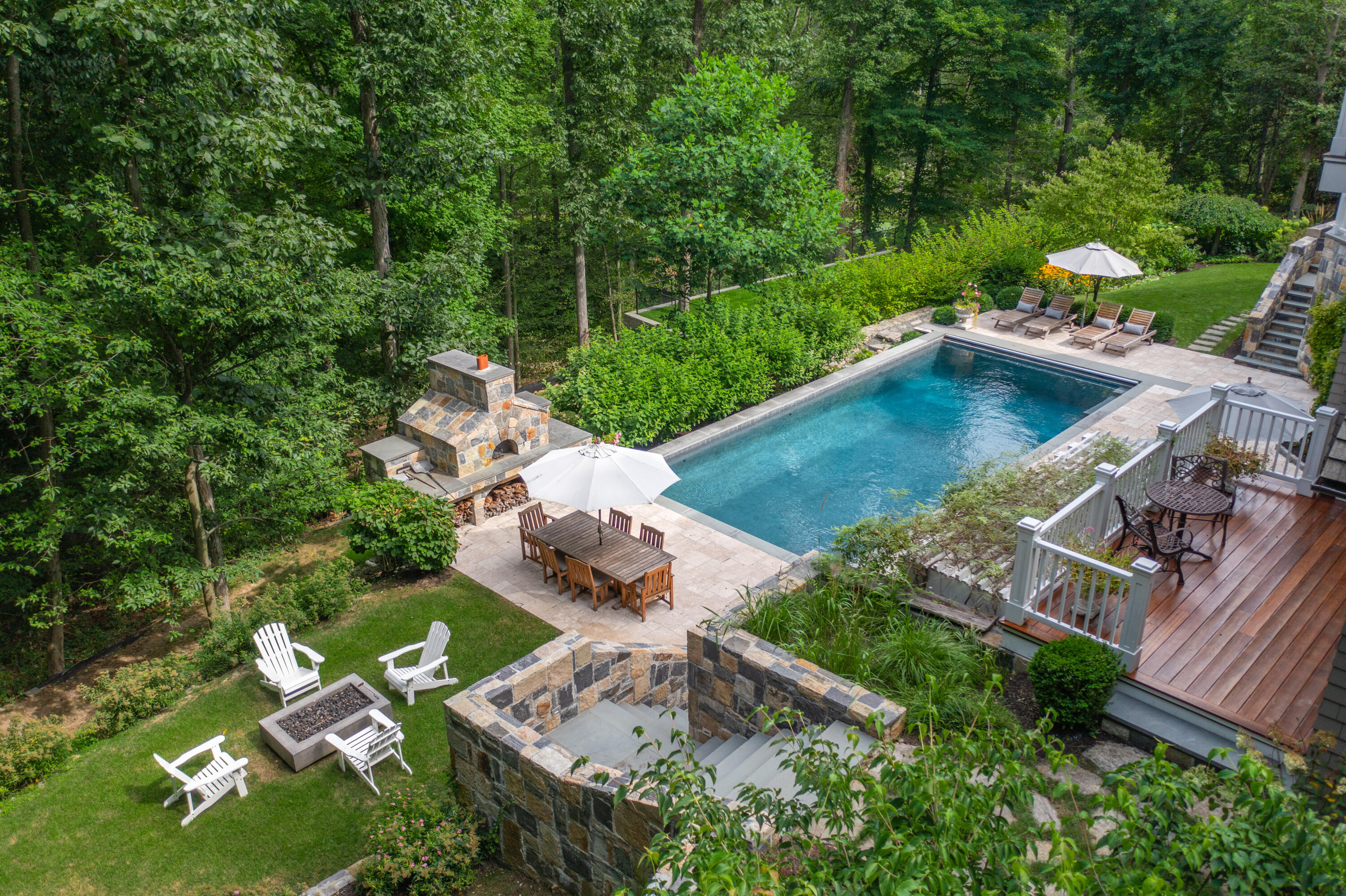163 Chichester Road New Canaan, CT 06840 - Photo 2 of 40 an aerial view of a house with a yard basket ball court and outdoor seating
