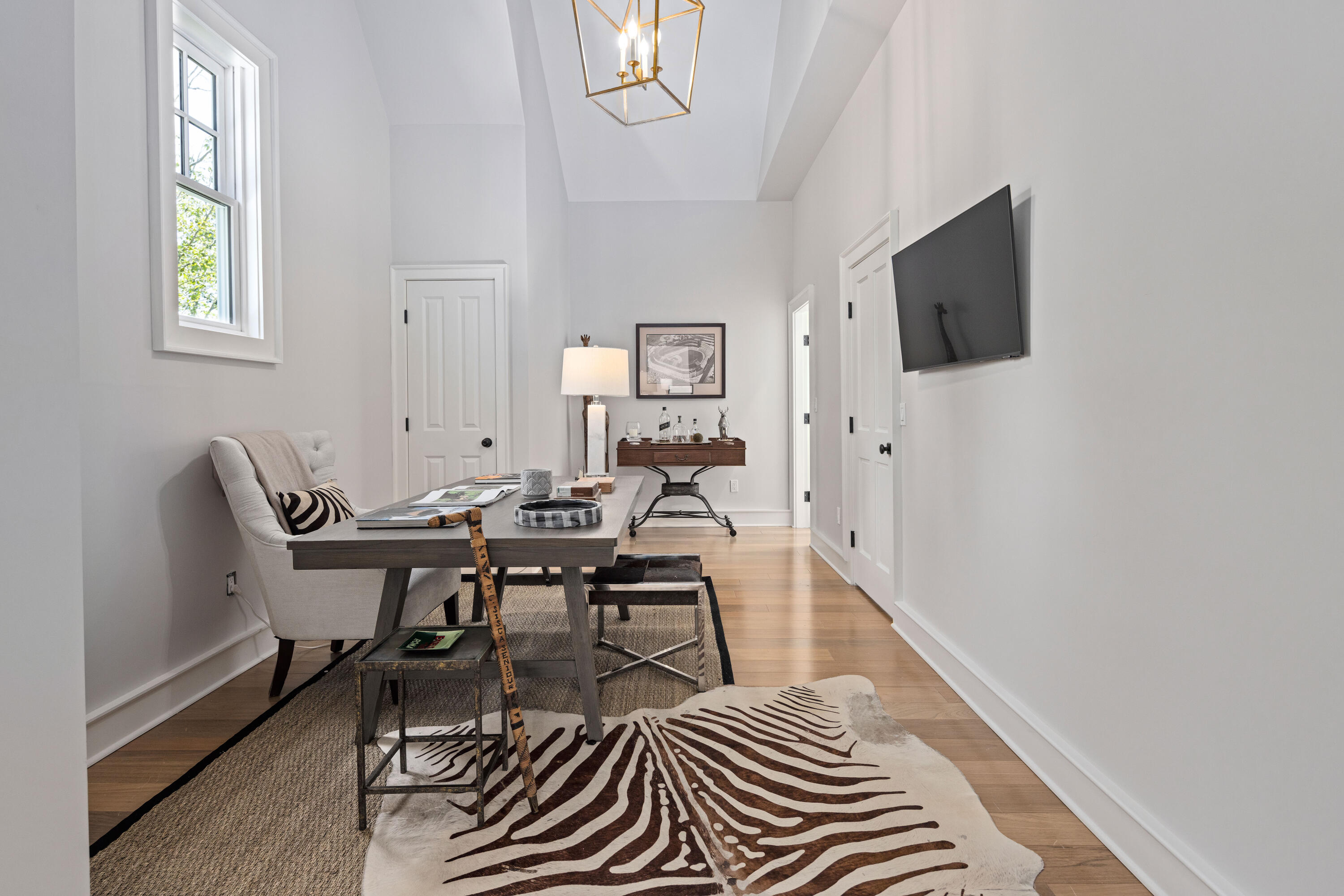 163 Chichester Road New Canaan, CT 06840 - Photo 24 of 40 a workspace with wooden floor and a window