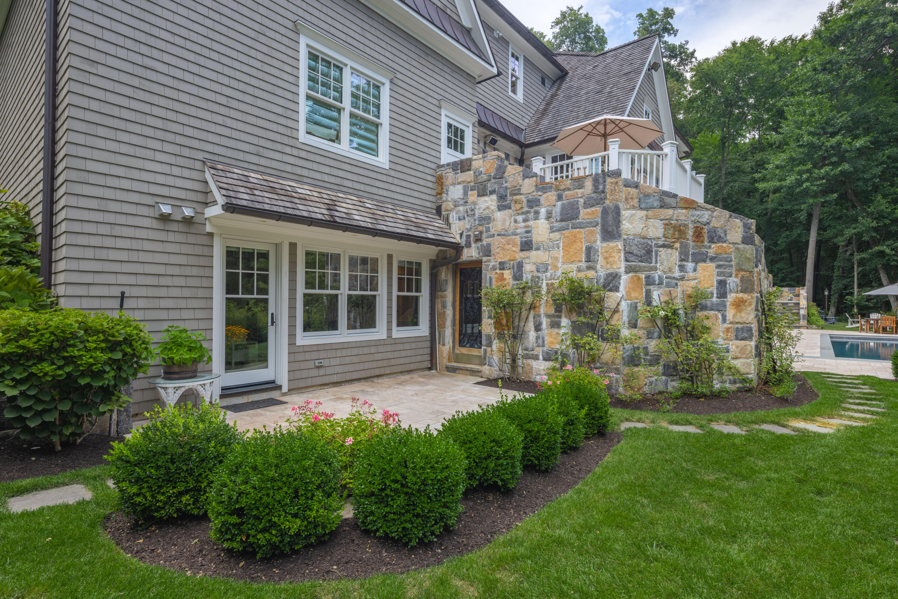 163 Chichester Road New Canaan, CT 06840 - Photo 30 of 40 a view of an apartment with a garden