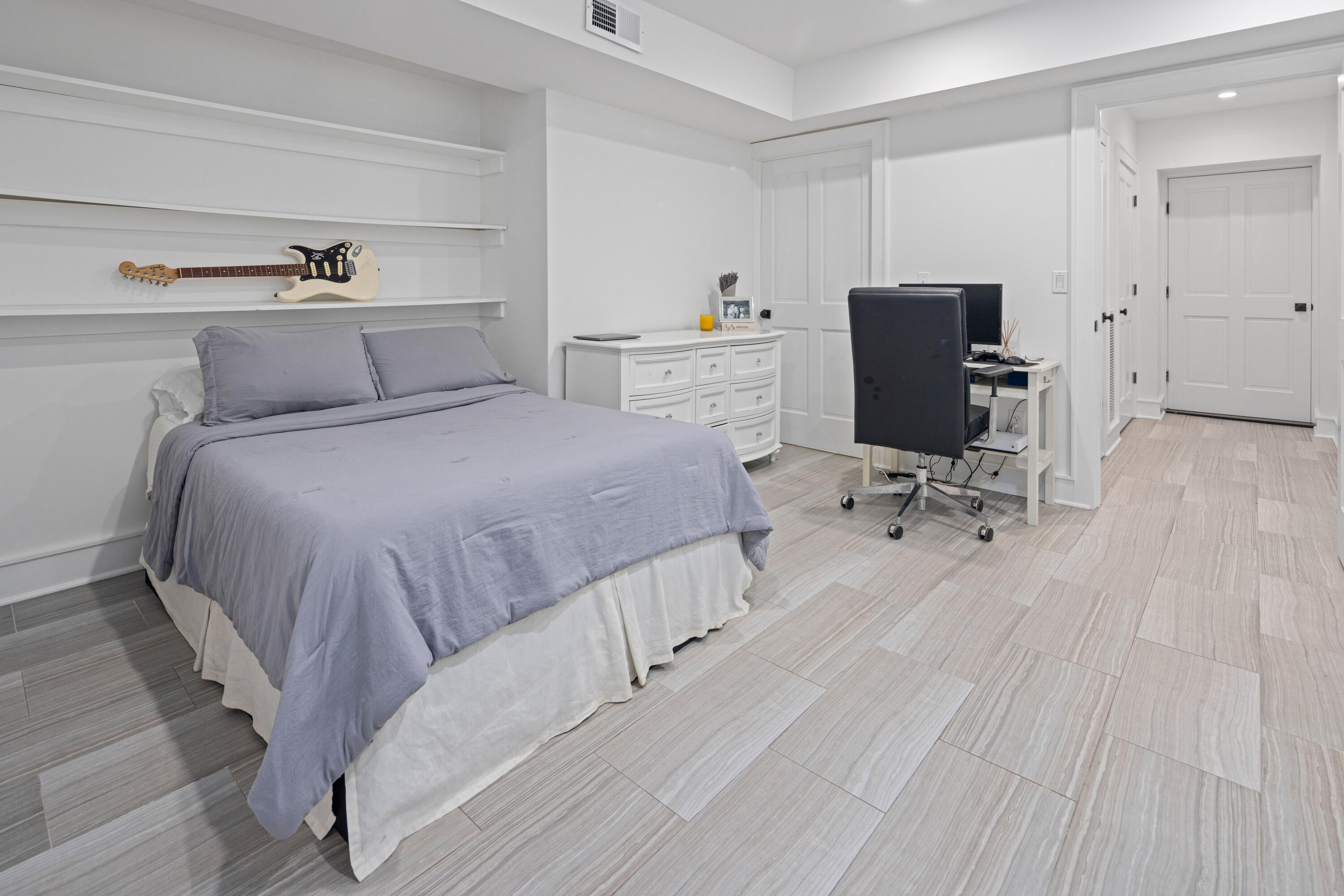 163 Chichester Road New Canaan, CT 06840 - Photo 34 of 40 a bedroom with a bed and wooden floor
