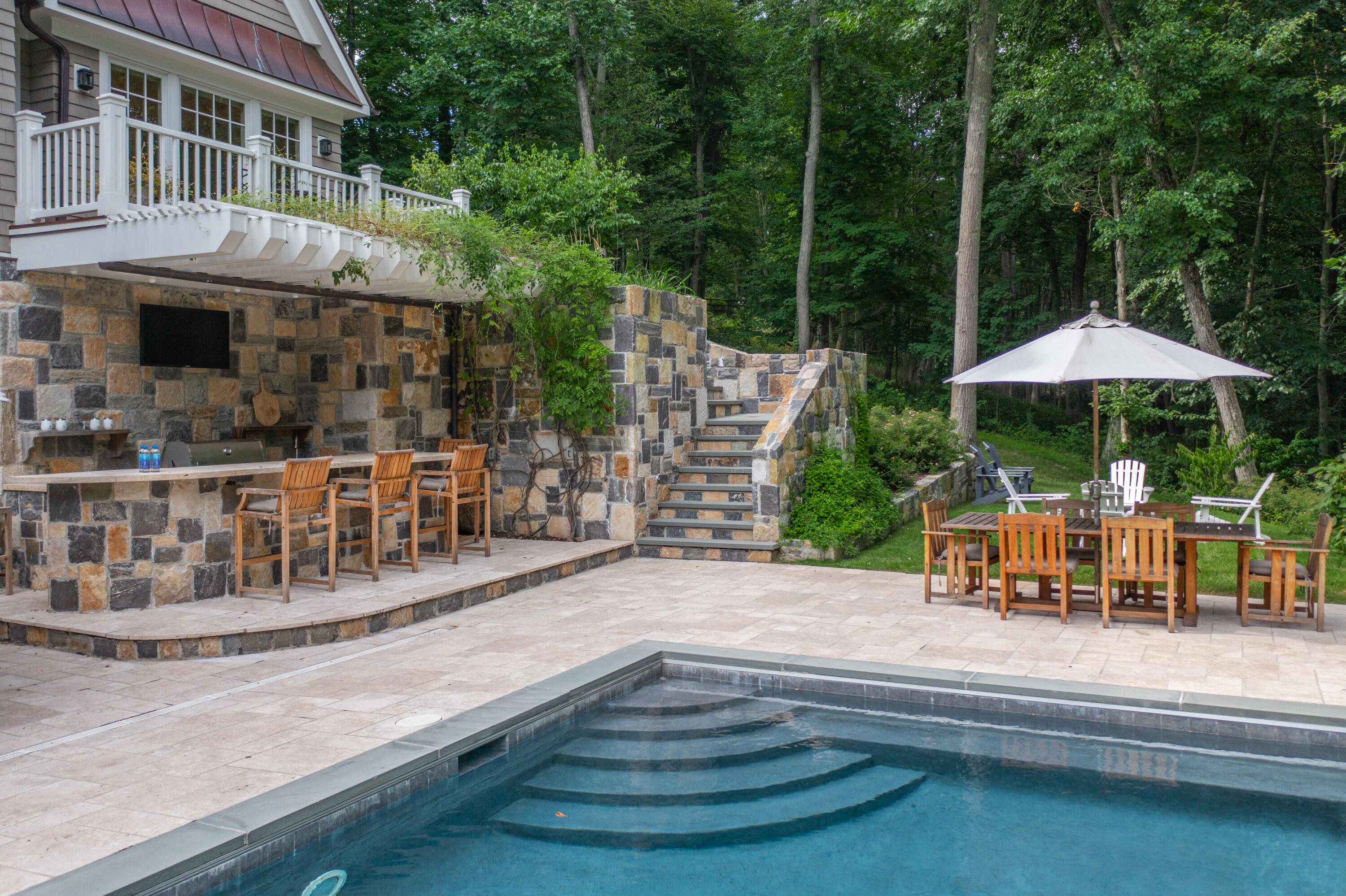 163 Chichester Road New Canaan, CT 06840 - Photo 36 of 40 a view of pool with outdoor seating