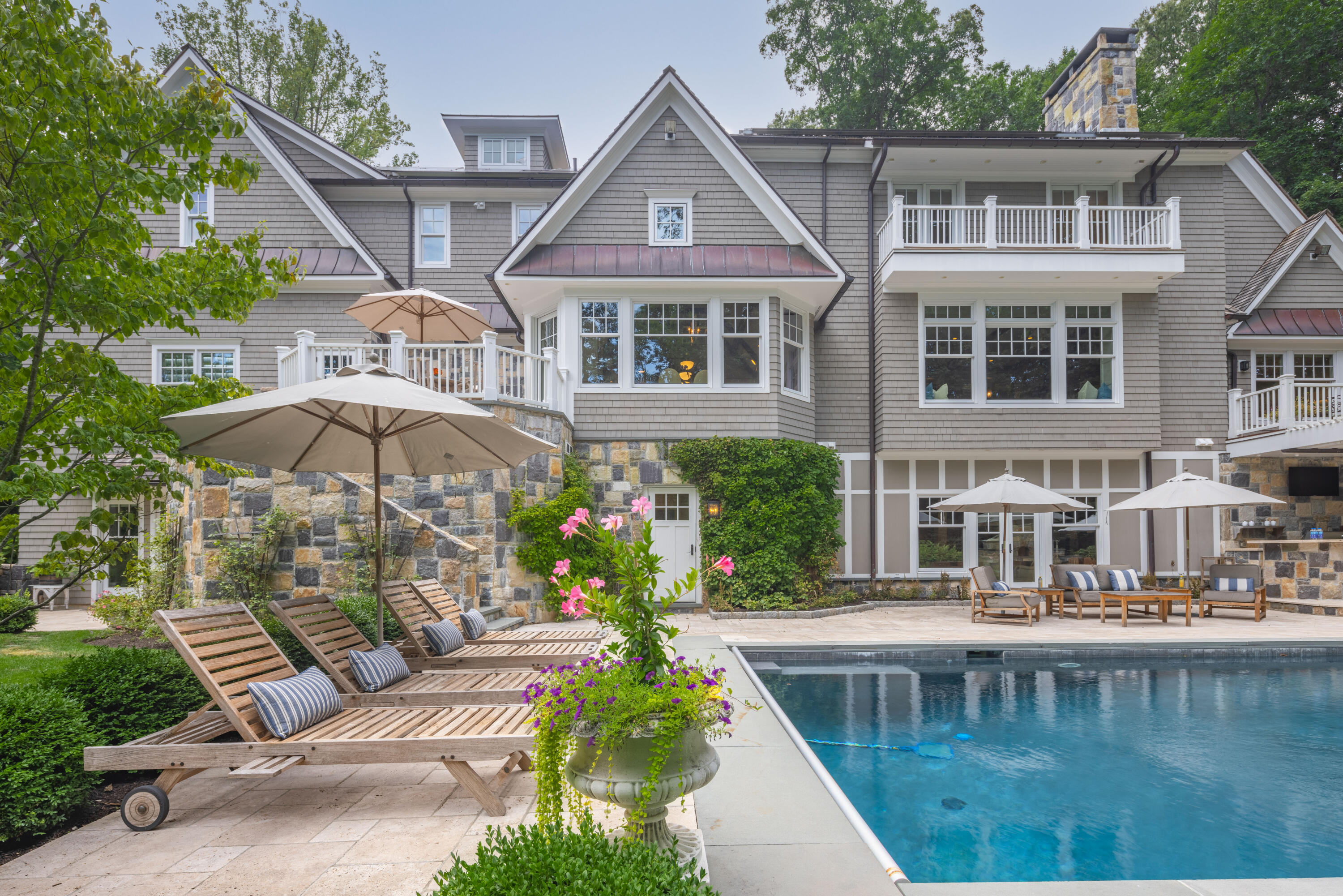 163 Chichester Road New Canaan, CT 06840 - Photo 37 of 40 a aerial view of a house with swimming pool and furniture
