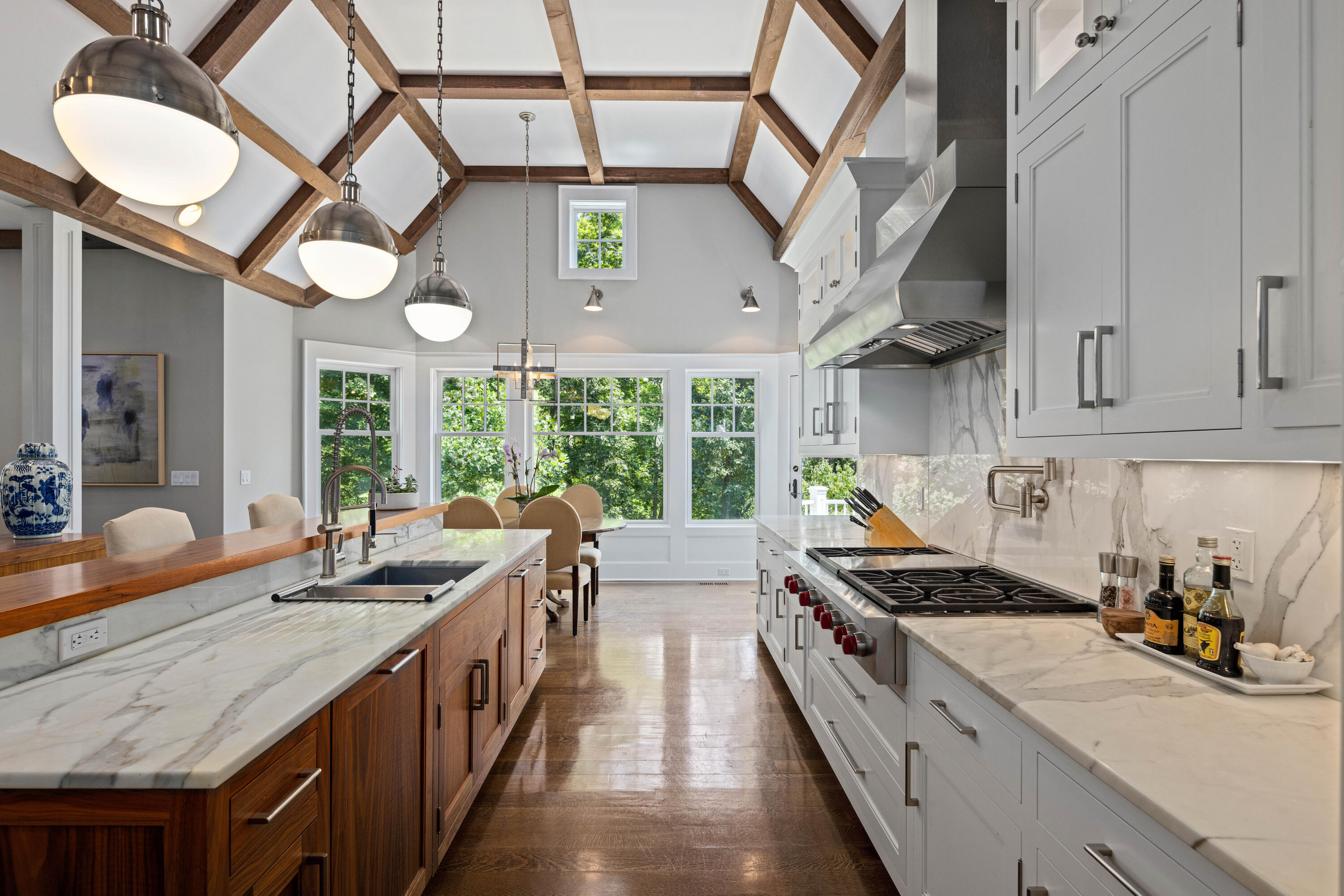 163 Chichester Road New Canaan, CT 06840 - Photo 4 of 40 a kitchen with stainless steel appliances granite countertop a sink a stove and a wooden floors