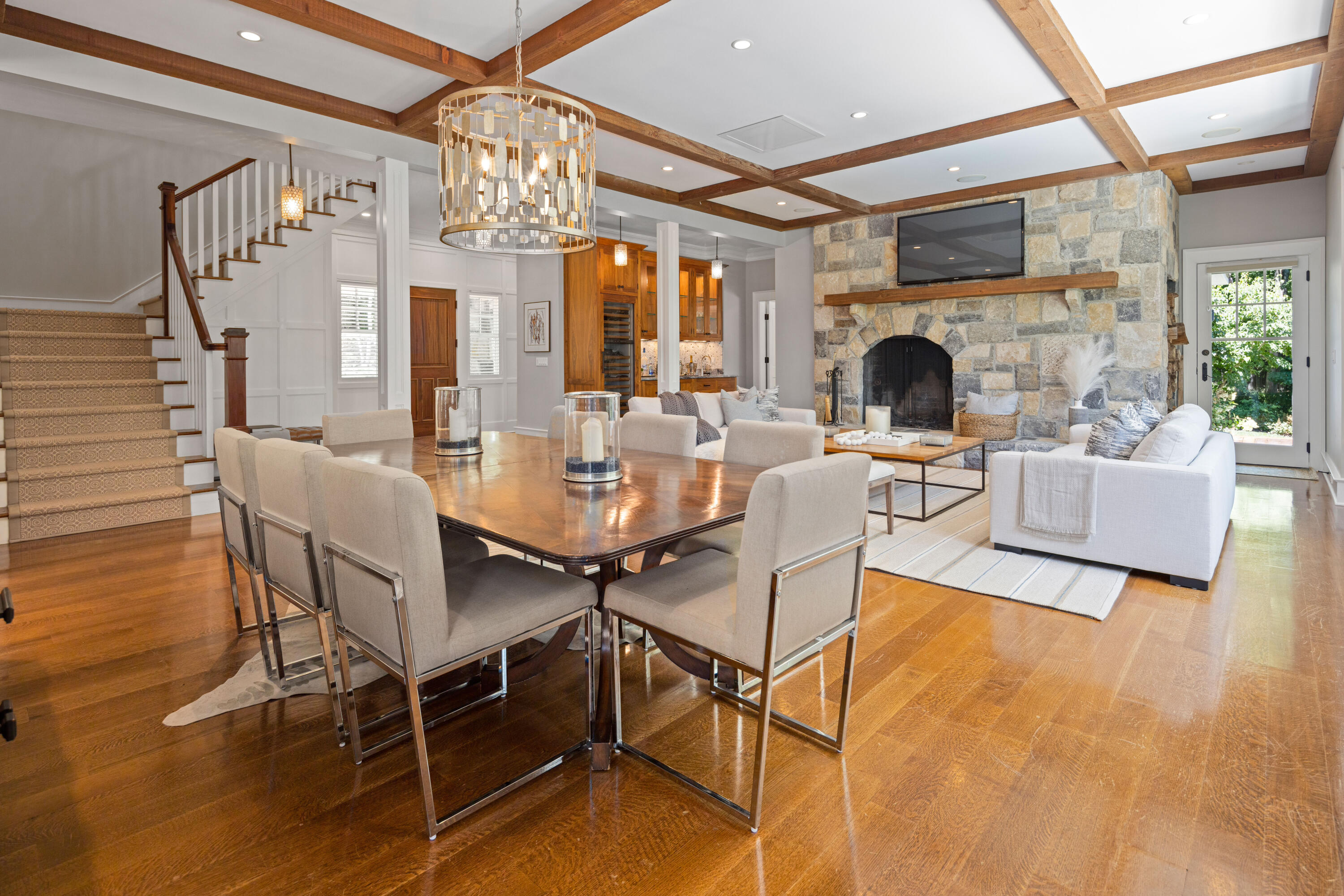 163 Chichester Road New Canaan, CT 06840 - Photo 8 of 40 a living room with fireplace furniture and a chandelier