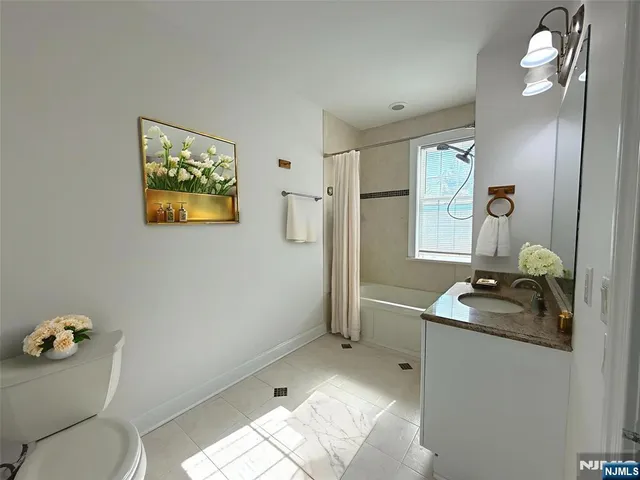 a bath tub sitting next to a window