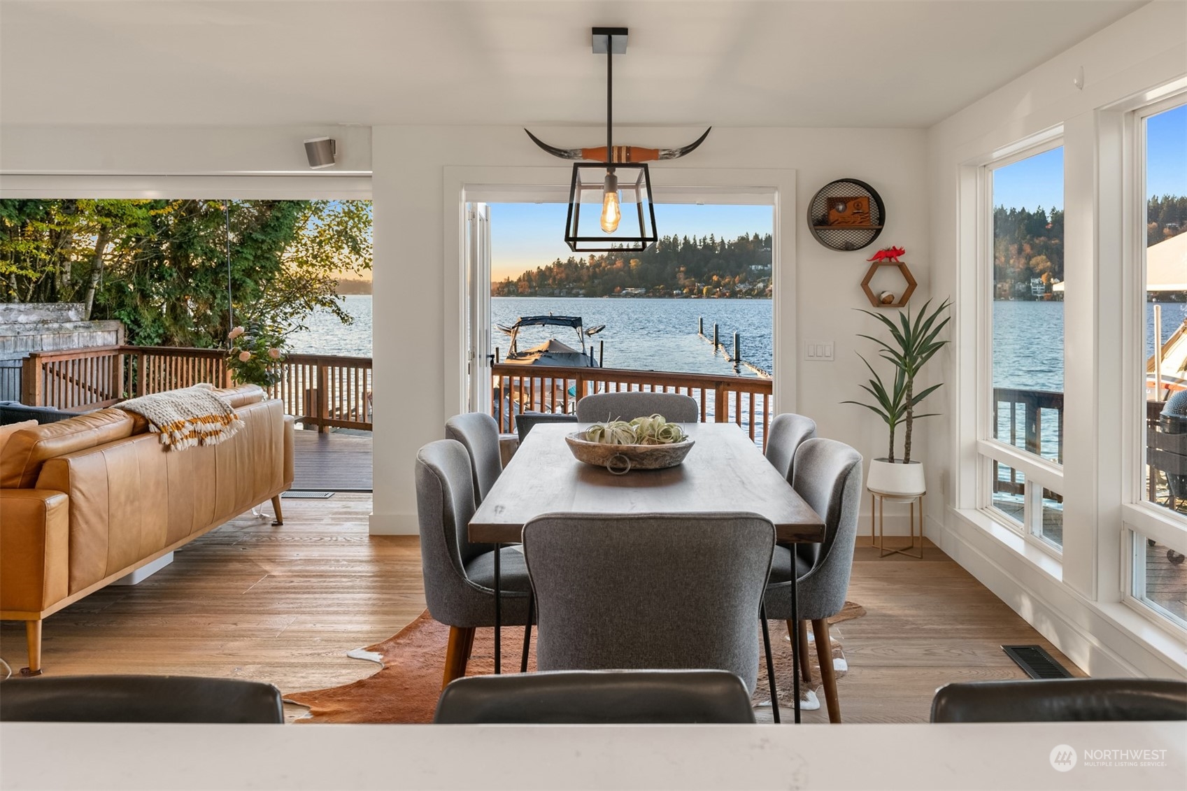 3901 Lake Washington Boulevard North Renton, WA 98056 - Photo 13 of 31 a view of a dining room with furniture window and wooden floor