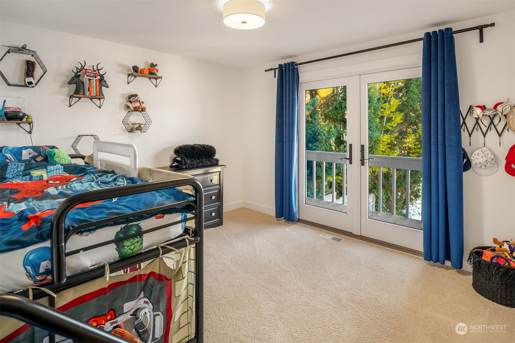 3901 Lake Washington Boulevard North Renton, WA 98056 - Photo 20 of 31 a view of a bedroom with baby bed and a window