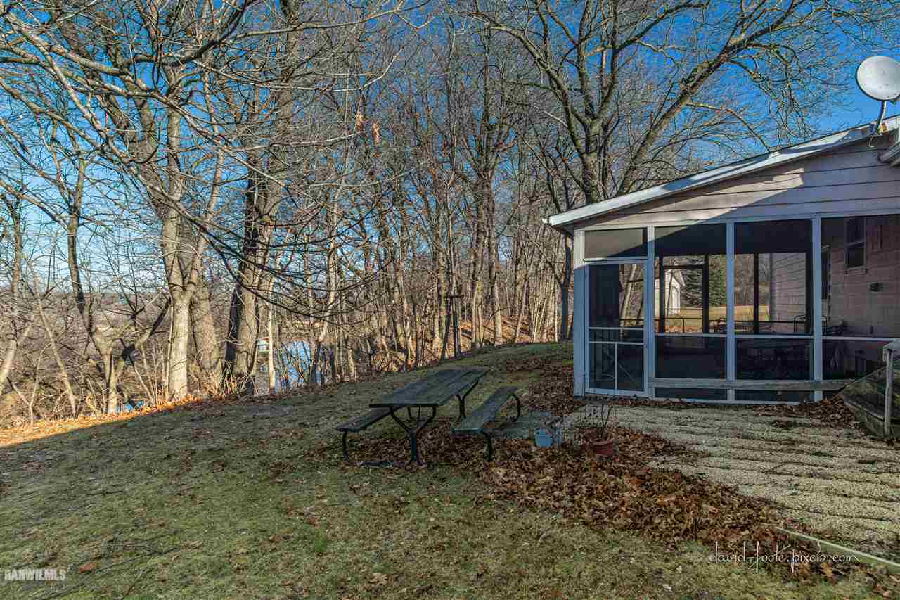 2796 West Hanover Road Hanover, IL 61041 - Photo 27 of 39 a backyard of a house with barbeque oven and wooden fence