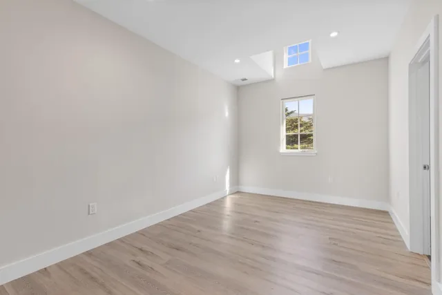 a view of a hallway with washer and dryer