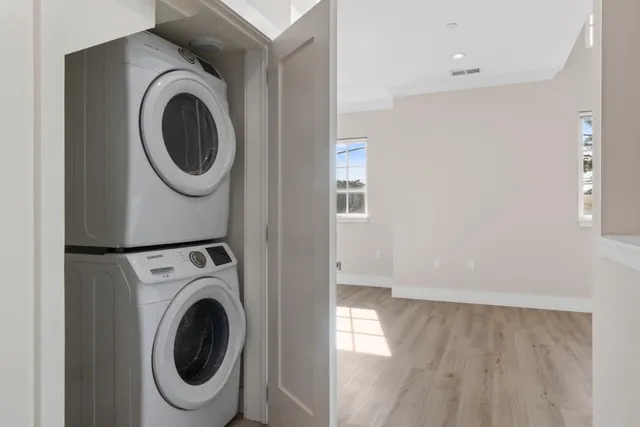 a view of kitchen with wooden floor electronic appliances and window
