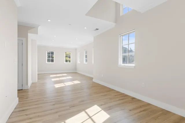 a large kitchen with cabinets and stainless steel appliances