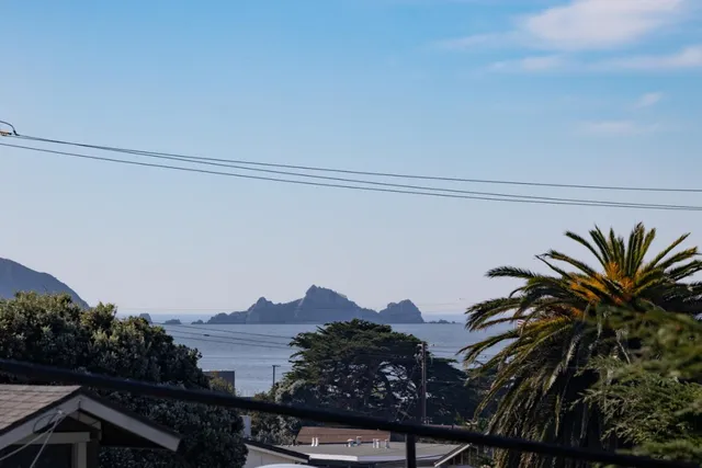 a view of a town with mountains in the background