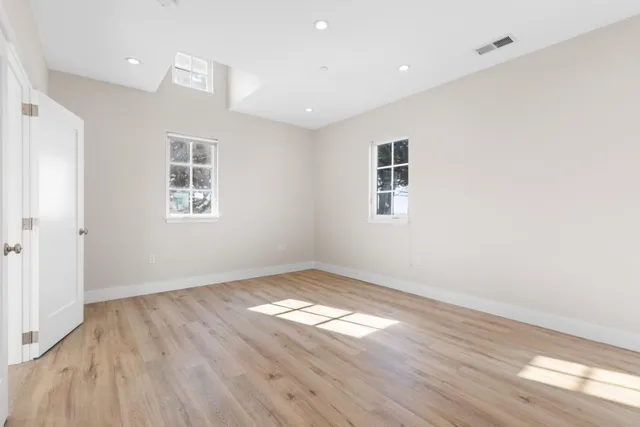 a bathroom with a sink double vanity granite tub and shower