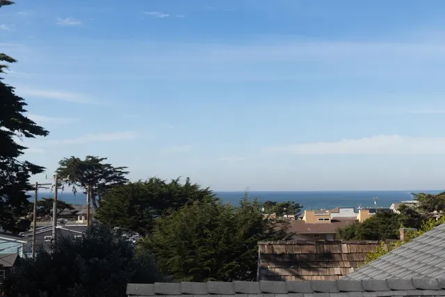 an aerial view of beach and ocean