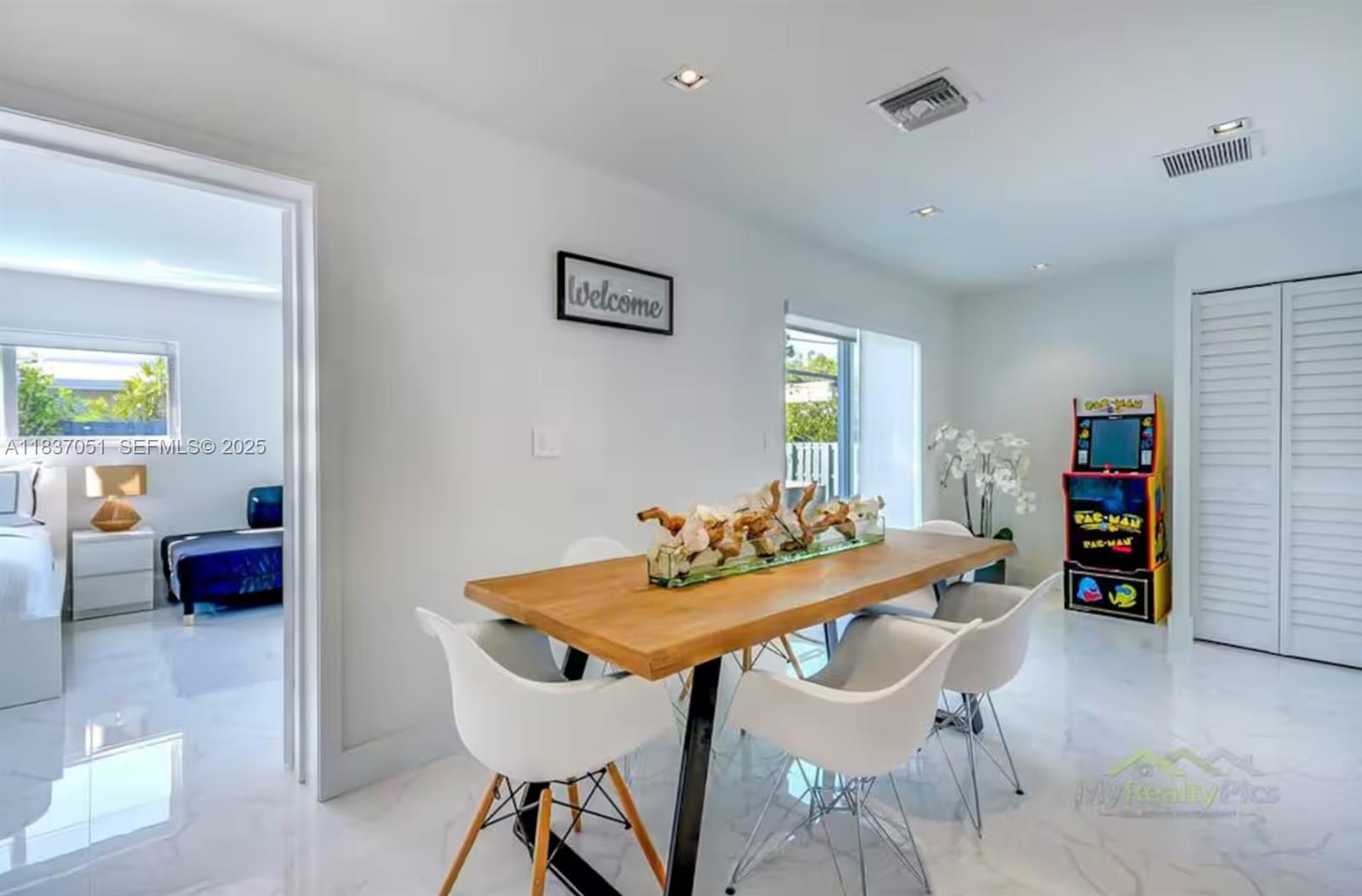 10010 Southwest 162nd Street Miami, FL 33157 - Photo 13 of 22 a view of a dining room with furniture and a table