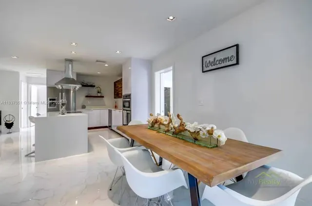 a bedroom with a bed and a chair