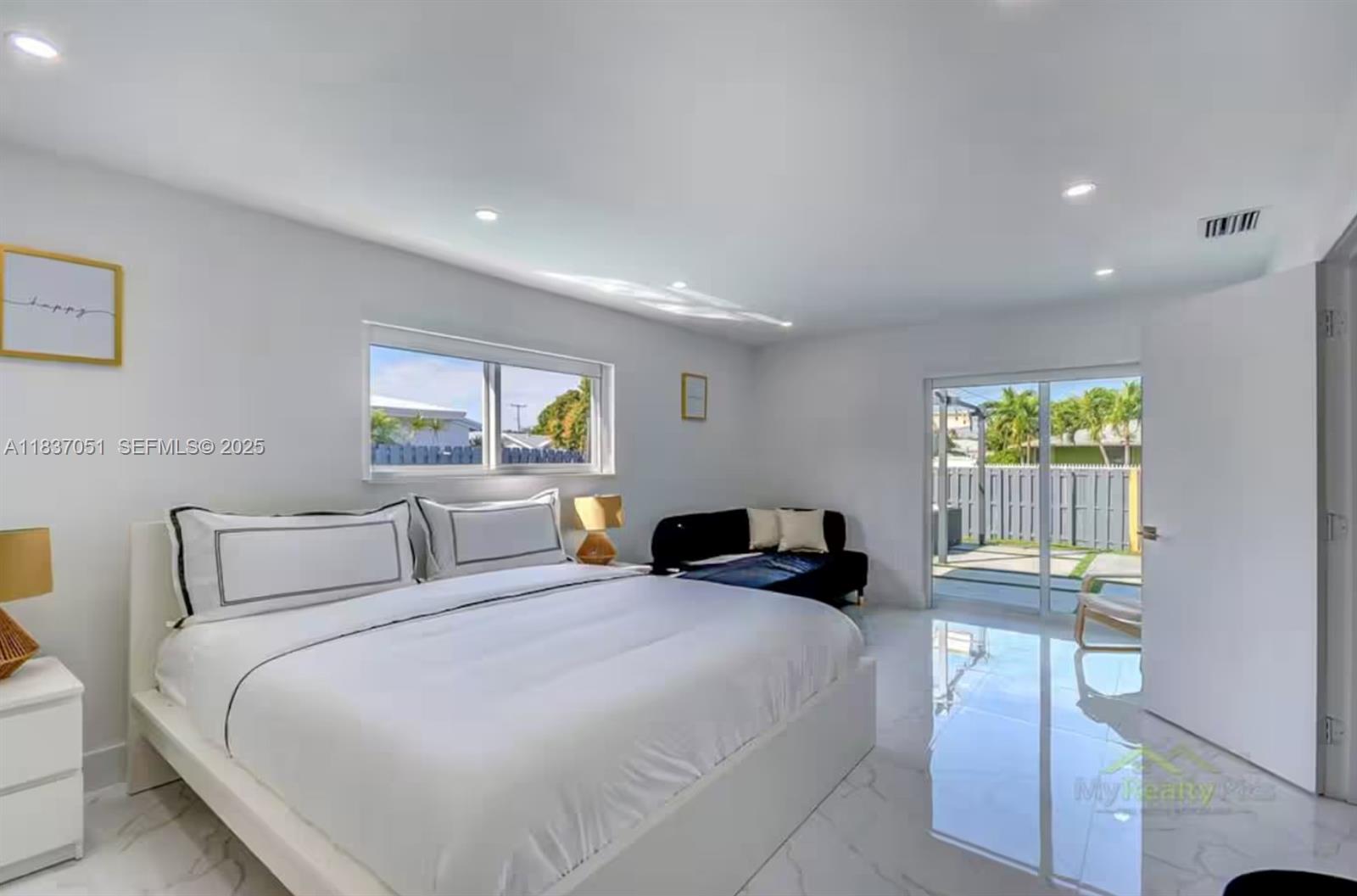 10010 Southwest 162nd Street Miami, FL 33157 - Photo 15 of 22 a bedroom with a bed and a chair