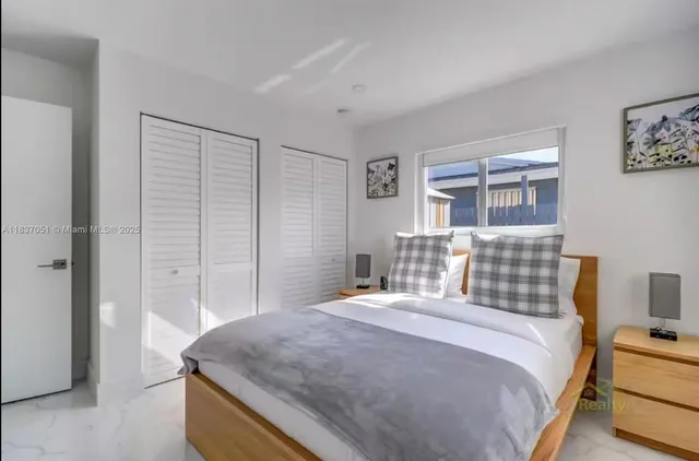 a bedroom with a bed and a chair