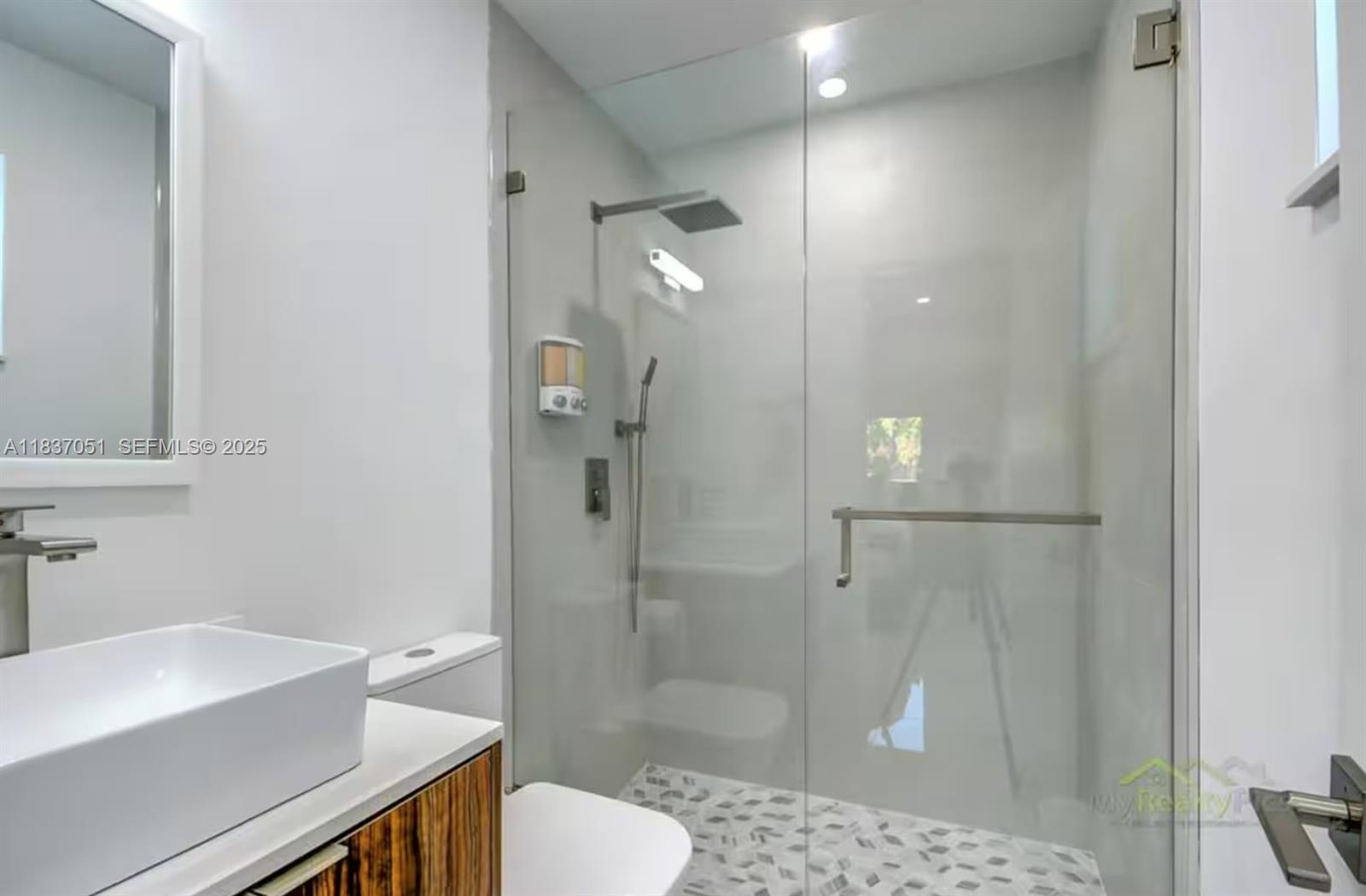 10010 Southwest 162nd Street Miami, FL 33157 - Photo 20 of 22 a bathroom with a sink toilet and shower
