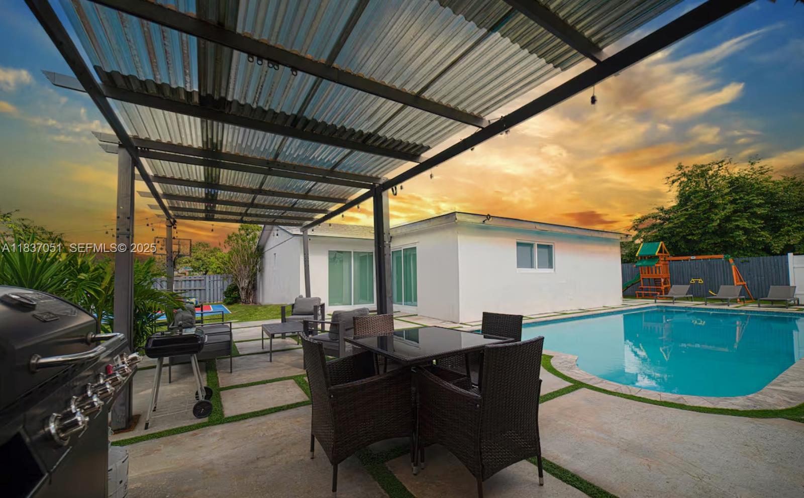 10010 Southwest 162nd Street Miami, FL 33157 - Photo 2 of 22 a view of backyard with outdoor seating a patio and plants