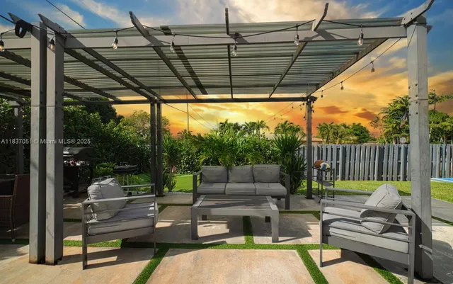 a patio with patio a couch and chairs