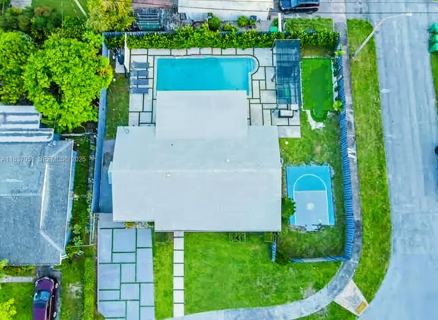 10010 Southwest 162nd Street Miami, FL 33157 - Photo 7 of 22 an aerial view of a house having yard