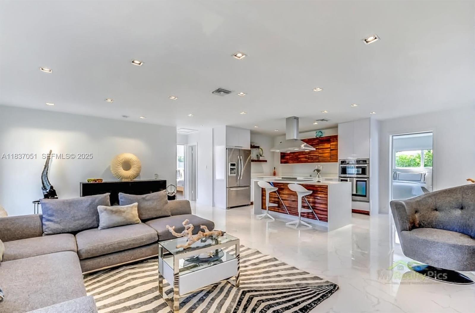 10010 Southwest 162nd Street Miami, FL 33157 - Photo 9 of 22 a living room with furniture and a wooden floor